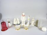 many figurines that are sitting on a white surface