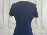 the back of a blue shirt on a mannequin mannequin mannequin mannequin mannequin mannequin mannequin mannequin