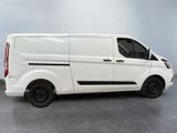 the white van is parked in a large room with a gray floor