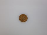 a close up of a coin on a white surface with a white background