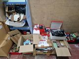 a pile of boxes and boxes of shoes on the floor