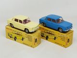 two toy cars that are sitting on top of a box