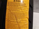 someone is holding a bottle of continental tire oil in their hand