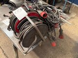 a table that has a bunch of hoses on top of it