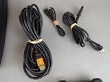 a lot of wires and cords that are connected to a computer