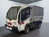 a white truck that is parked inside of a building