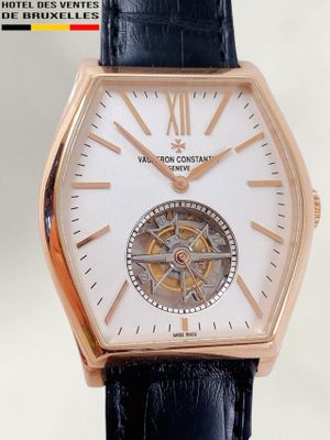 a close up of a wrist watch with a black strap