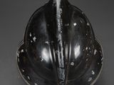 a close up of a helmet on a plate on a table