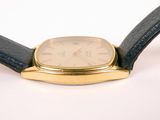 an image of a close up of a watch on a white surface