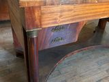 a wooden table with a laptop on top of it