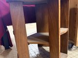 a small wooden table with a shelf on top of it