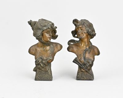 pair of bronze busts of a man and a woman