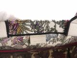a close up of a purse on a table