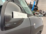 a sticker on the side of a car that is parked in a garage