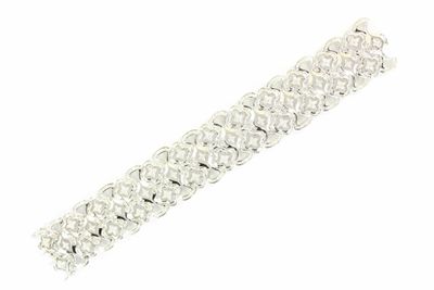 a close up of a silver bracelet on a white background
