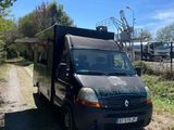 a black van that is parked on the side of the road