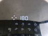 a close up of a digital clock on the side of a table