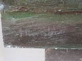 a close up of a piece of wood that has been painted green