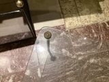 a glass table with a mirror on it in a bathroom