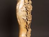 a vase that is sitting on a table with a black background
