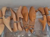 a lot of wooden spoons hanging from a rack