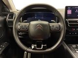 the interior of a car with a steering wheel and dashboard controls