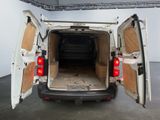 a white van with its doors open in a room