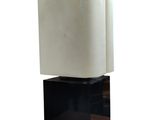 a black and white sculpture of a cube on a black base