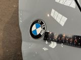 a sticker on the hood of a car that has a bmw logo on it