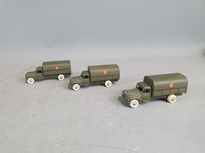 three toy trucks that are sitting next to each other