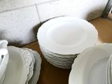 a lot of plates that are sitting on a table