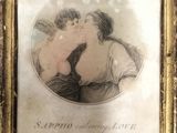 an old picture of a couple kissing each other in front of a picture