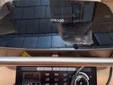 a smart phone sitting on top of a remote control