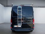 a black van with a ladder on the back of it