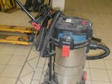 a vacuum that is sitting on the floor in the room