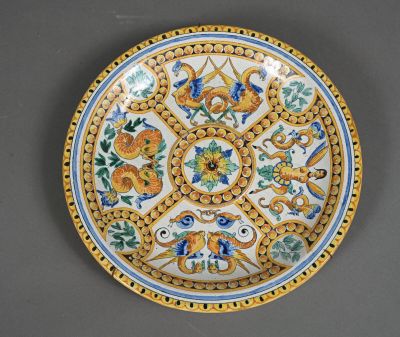 a close up of a decorative plate with flowers and birds on it