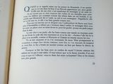 a open book with a picture of a landscape on it