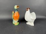 pair of ceramic figurines of a bird and a duck