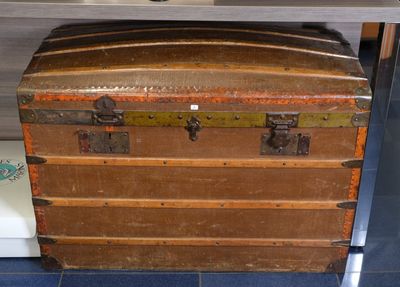 an old trunk sitting on a table in a room