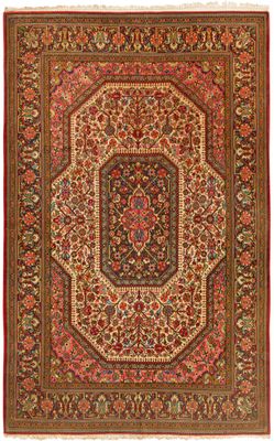 an antique persian rug with a medallion design on a red ground
