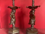 pair of antique bronze candlesticks with cherensils and cherensils