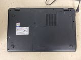 a laptop that is sitting on a table with a cord attached to it
