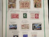 an open book with a bunch of different stamps on it