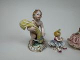 three figurines that are sitting on top of each other