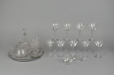 a lot of wine glasses and a tray on the table