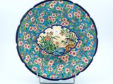 an image of a decorative plate with flowers on it