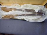 three wooden utensils in a case on a table