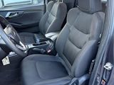 the interior of a car with two black seats and a steering wheel
