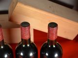 three bottles of wine sitting next to each other on a table