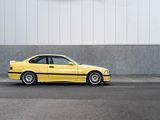a yellow car that is parked in front of a building